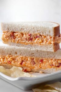 A pimento cheese sandwich cut in half and stacked