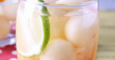 A honey deuce cocktail filled with frozen melon balls