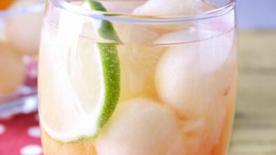 A honey deuce cocktail filled with frozen melon balls