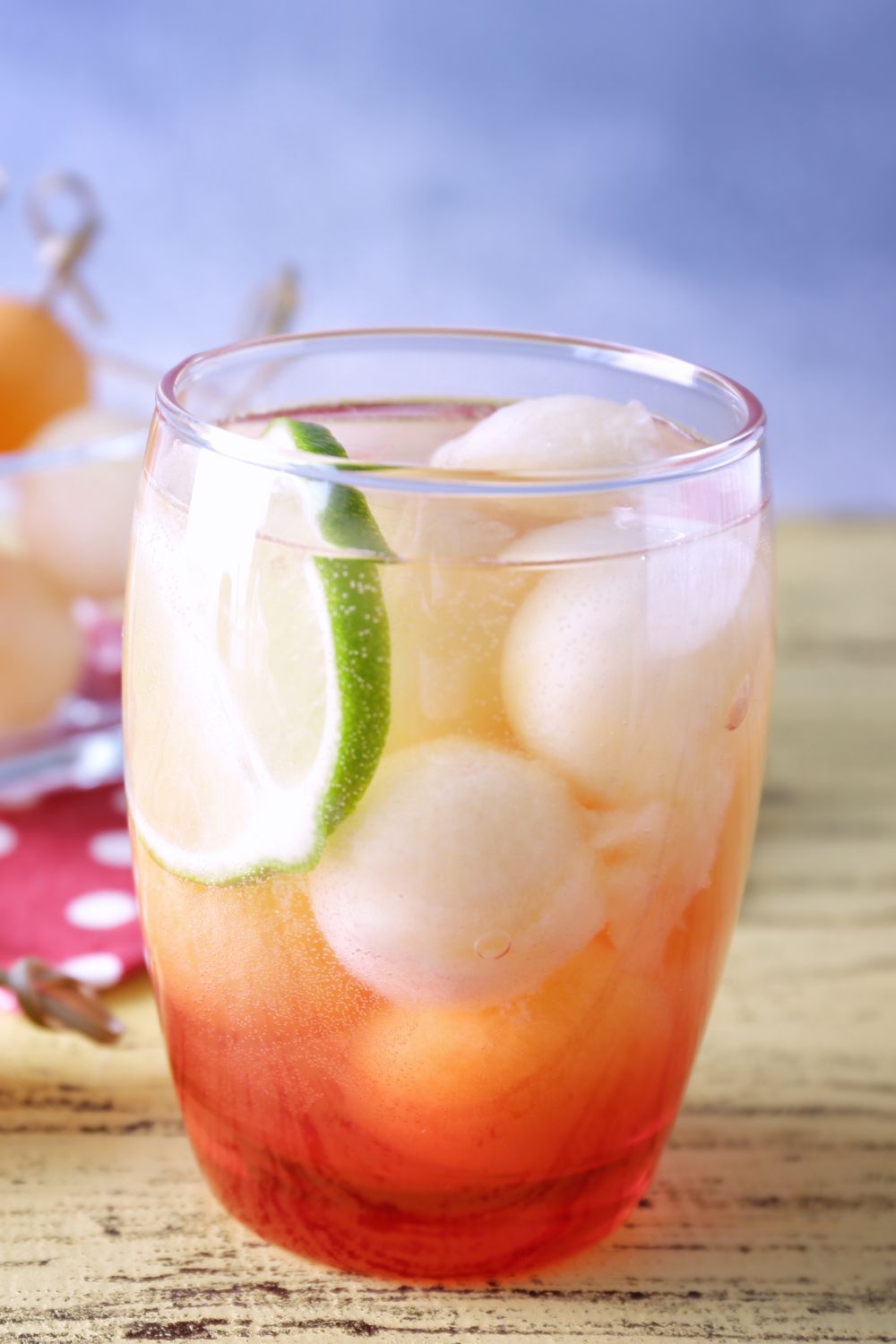 A honey deuce cocktail filled with frozen melon balls