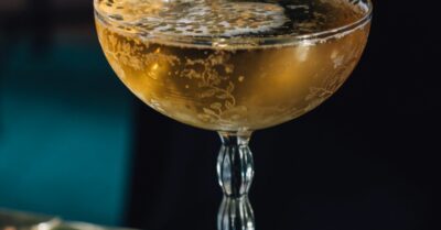 A jockey club cocktail in a coup glass