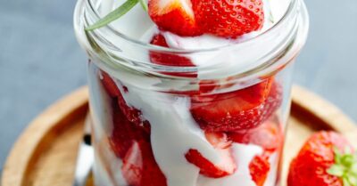 Wimbledon strawberries and cream in a mason jar