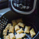 frozen pizza rolls in an air fryer basket