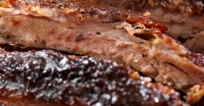 A plate of bbq baby back ribs.