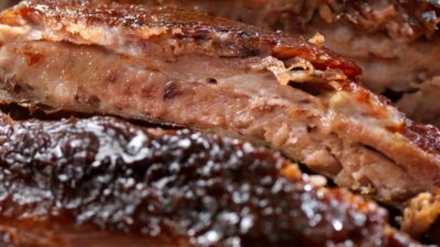 A plate of bbq baby back ribs.
