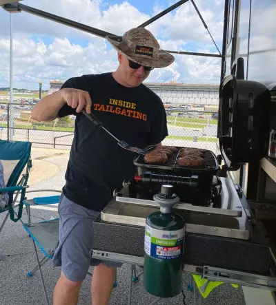 NASCAR Camping: The Perfect Family Tailgating Weekend 6 Grilling on a portable grill at Atlanta Motor Speedway Camping Experience