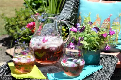 A Dozen Delicious Make-Ahead Pitcher Cocktails 2 Pitcher cocktail sitting on outdoor chair; pitcher cocktail recipes concept