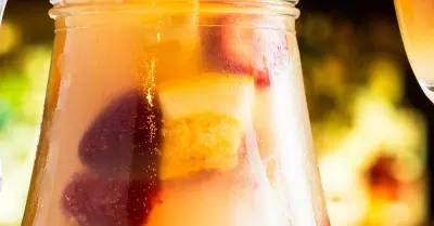 A pitcher filled with breakfast sangria and fruits