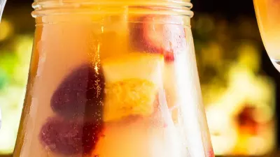A pitcher filled with breakfast sangria and fruits