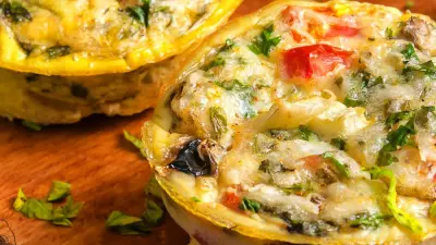 Healthy breakfast egg cups on a wooden cutting board.