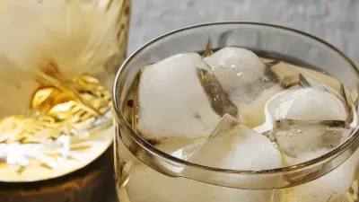 The overtime cocktail with Jameson whisky in a highball glass filled with ice