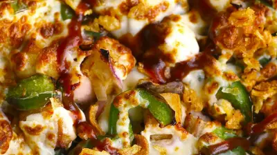 a bbq chicken pizza with green pepper