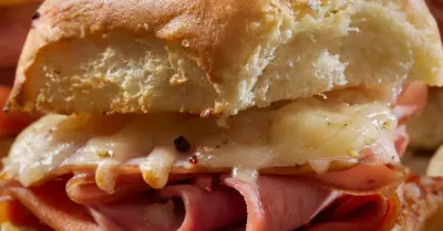 A close image of a croque monsieur slider with ham and cheese
