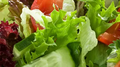 A green jacket salad with cherry tomatoes, lettuce and cucumber