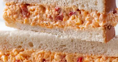 A pimento cheese sandwich cut in half and stacked