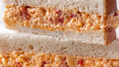 A pimento cheese sandwich cut in half and stacked