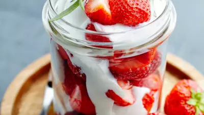 Wimbledon strawberries and cream in a mason jar