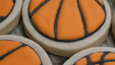A bunch of basketball sugar cookies.