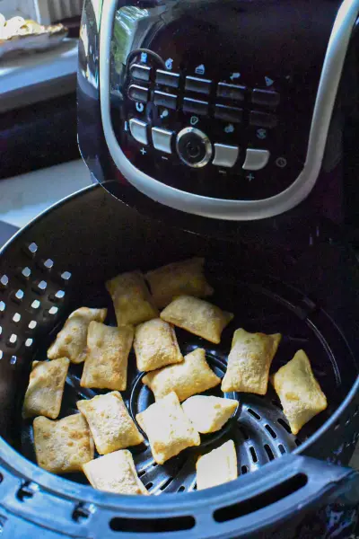 Air Fryer Pizza Rolls 4 frozen pizza rolls in an air fryer basket