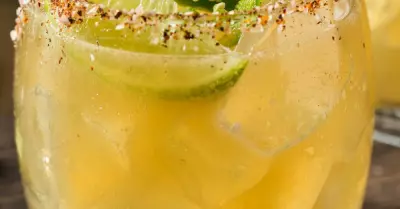 A desert heat cocktail in a glass with a lime slice