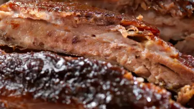 A plate of bbq baby back ribs.